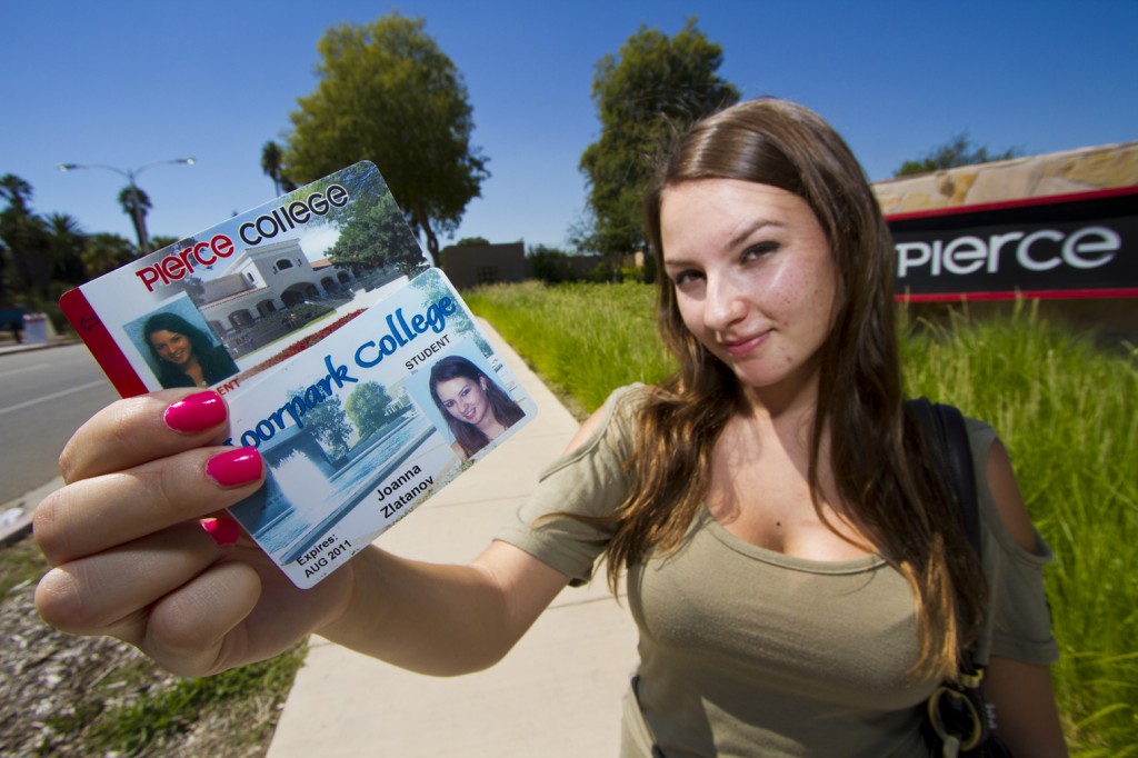 Joanna Zlatanov Poses with her two Student ID cards outside of Pierce College. Due to budget cuts Zlatanov had to enroll at Moorpark College in order to take the core classes that were unavailable to her at Pierce College. Photo: Jose Romero