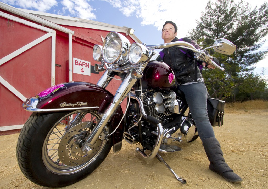 Pierce College student Randi Katz poses by the red barn on her motorcycle. Katz has academically excelled despite a troubled past. Photo: Jose Romero
