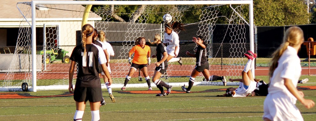 Pierce College women's soccer sophomore midfielder Daisy Alvarenga heads the ball towards the goal after a free kick in a math up at Ventura College between the Brahmas and the Pirates on September 12, 2011. Pierce won the game 2-1. Roundup Javier Zazueta.