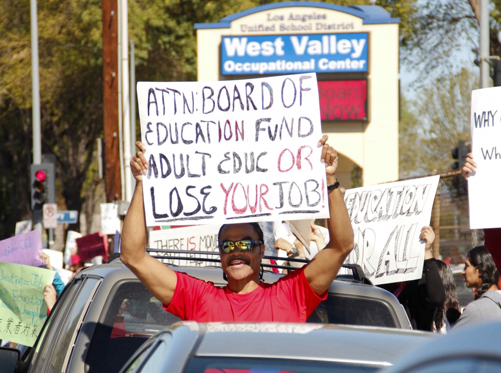 Ari Green, a veteran and student at West Valley Occupational Center, stands in-between cars as traffic flows by. The protest was held Wednesday, February 8, 2012, at the intersection of Winnetka Avenue and Victory Boulevard. Students protest against the closing of adult schools. West Valley Occupational Center located in Woodland Hills, Calif.  Photo: Kristen Aslanian