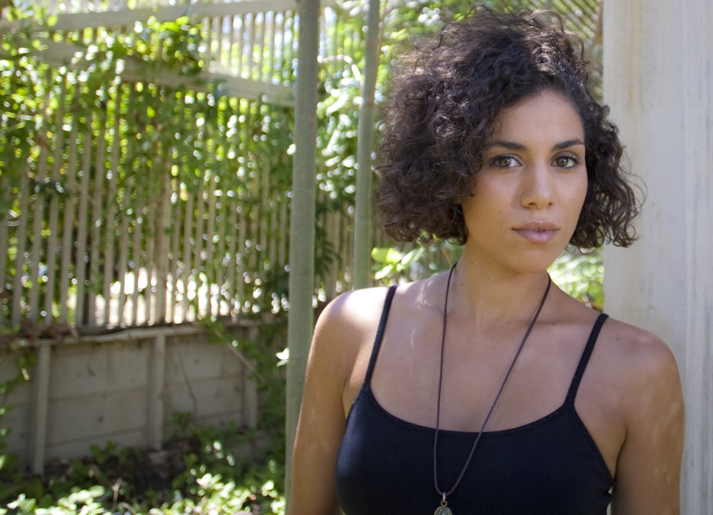 Andrea Sixtos poses in an abandoned horticulture building at Pierce College on July 7, 2012 in Woodland Hills, Calif. Sixtos chose this area of the campus because its natural beauty and unfortunate state of disrepair. Photo: UD