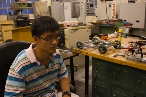 President of the Robtics Club, Yiran Tong, mechanical engineer, does mentoring for some of the local highschool's robotic clubs, Sept., 5, 2013, Applied Science building. photo: Omar Barilles