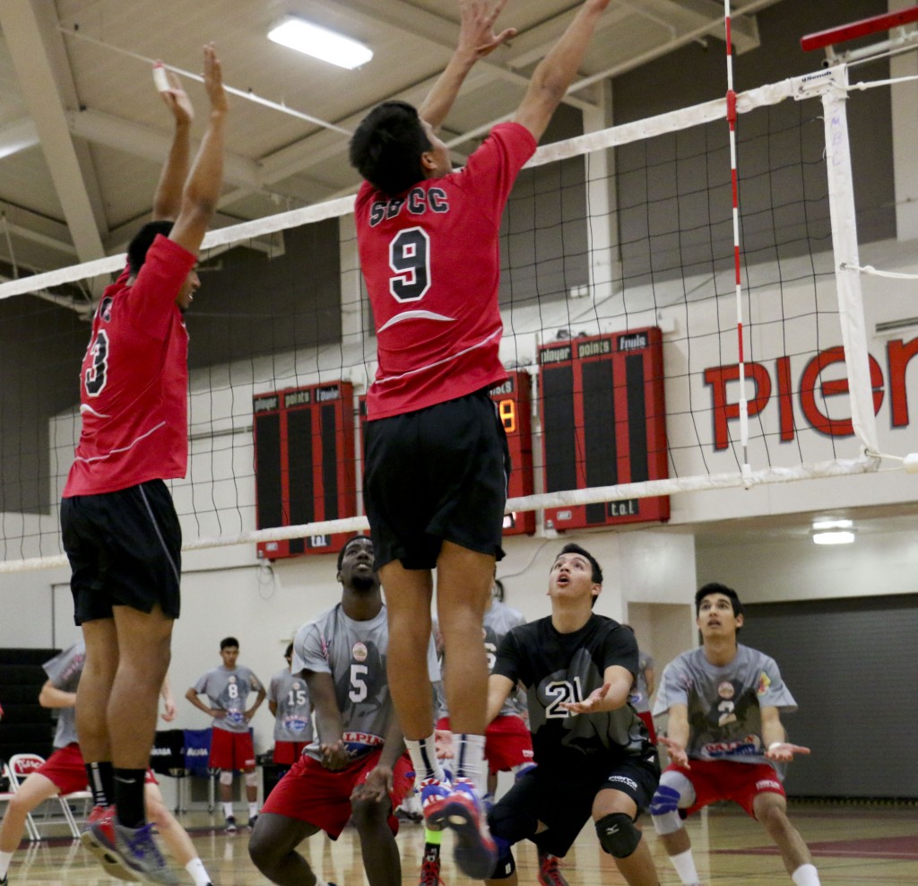 Pierce College plays defense as the Santa Barbara Men's Volleyball team spikes the ball on Wednesday, March 26, 2014 at Pierce College in Woodland Hills Calif. Photo: Giuliana Orlandoni