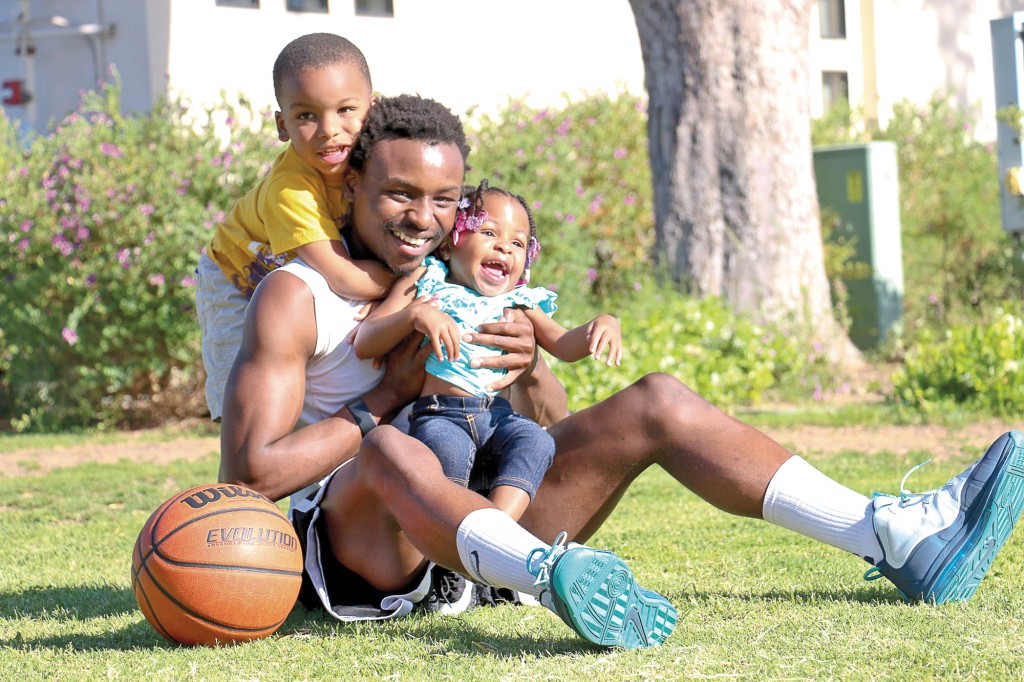 Lucious Coleman, a single father who attends Pierce College full time and plays for our school basketball team holds his daughter Remedy Coleman and son Kayden Coleman on April 24, 2014 at Pierce College in Woodland Hills CALIF. Photo: Giuliana Orlandoni