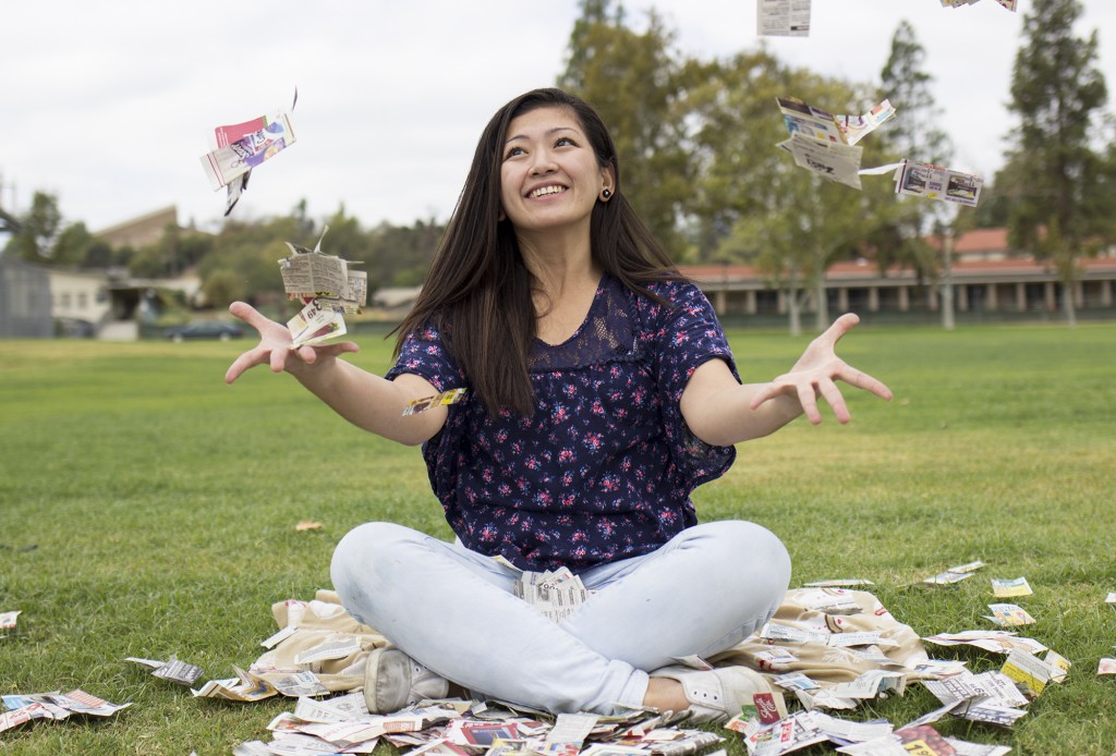 Extreme couponist, mother and nurse, Rea Tiu, plays with coupons by the soft ball field of Pierce College in Woodland Hills, Calif., Friday, Sept. 19, 2014. Photo: Nicolas Heredia