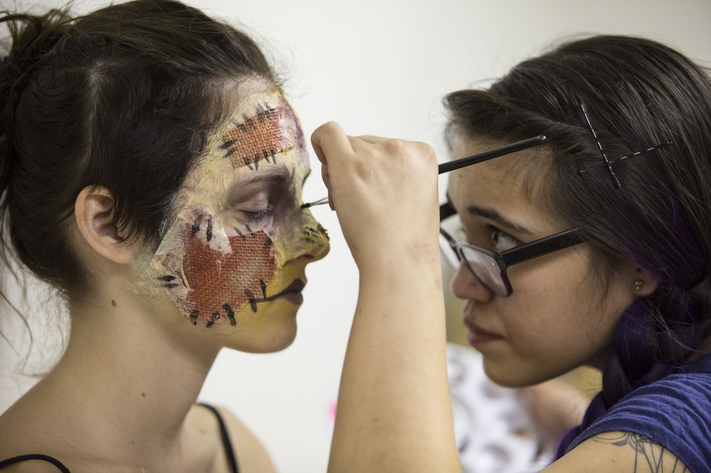 Michelle De La Cruz applies burlap, latex, tissue paper, and make up on scare actor Lea Moore for the grand opening of the 10th Harvest Festival at the Pierce Farm Center on Sept. 26, 2014.Photo: Diego Barajas