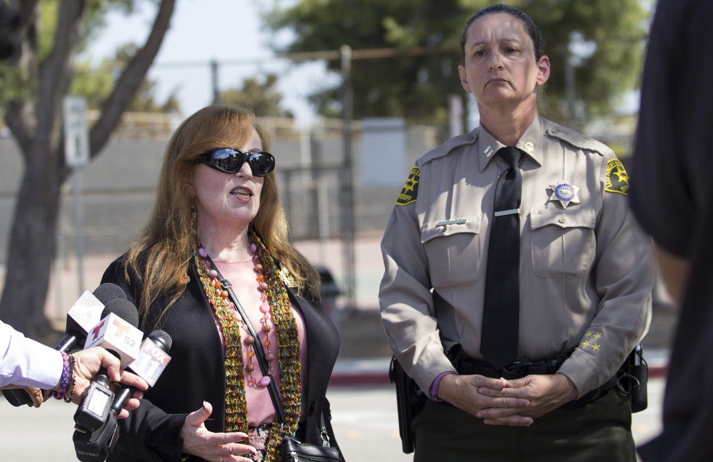 Pierce College President Kathleen Burke (left) and Captain Cherryl Newman-Tarwater (right) of the Los Angeles County Sheriffs Department hold a press conference by the Sheriffs station on the Pierce College campus in Woodland Hills, Calif., on Oct. 16, 2014. Pierce College was evacuated due to a threat posted on social media directed toward the school. A male 26-year-old former student was arrested off campus but was not found with any weapons on him, although he does have weapons registered in his name. Photo: Nicolas Heredia