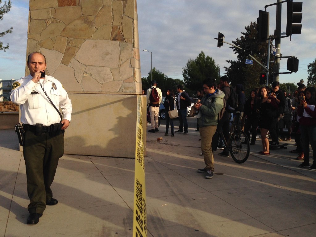 Billy Guzman, Sherrif's security at Valley college is assigned to shut down the campus entrance of Winnetka and Victory Blvd. after a suspected threat through Facebook that could potentially put students lives at risk on Oct. 16 around 8 a.m. Photo by Kristen Aslanian