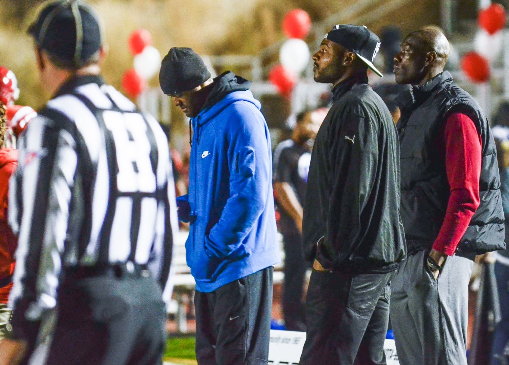 Former NFL player Terrell Owens (far right) stands on the sidelines of Pierce's game against Santa Monica College on Saturday, Nov. 15. Photo by: Stacy Soriano 