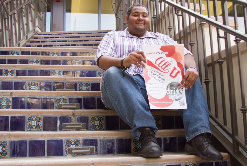 Henry Walk 30, Marketing Major holds a All-U poster. Walk is the creator of the program that has as main goal help students succeed in their academic lives, at Pierce College in Woodland Hills, Calif. on Nov 17, 2014. photo by Erick Ceron