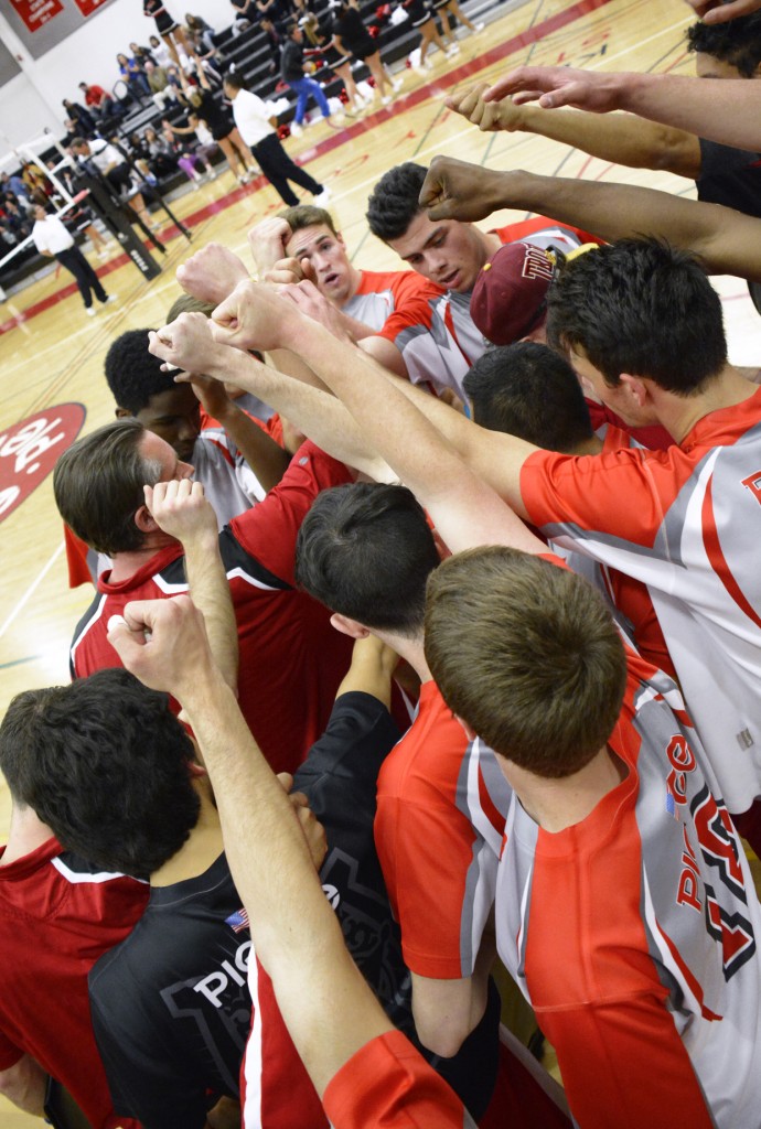 All for one and one for all as Head Coach Lance Walker of the Pierce College Men's Volleyball team brings the team together before going back on to the court against Moorepark Raiders on March 4th, 2015.  Woodland Hills, Calif. Photo by: Scott Aaronson