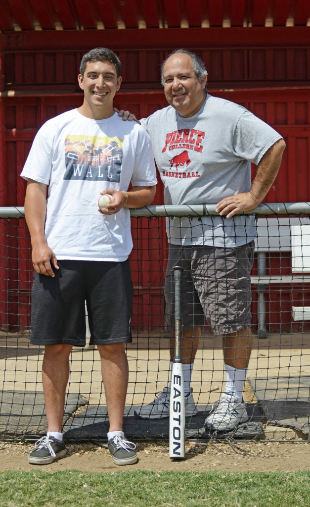 Pierce baseball pitcher, Adam Ramirez, poses for a portrait with his father, Athletic Trainer, Lenny Ramirez in the home dugout at Joe Kelly Field located at Pierce College in Woodland Hills, Calif. on April 30, 2015. Photo by: Skylar Lester