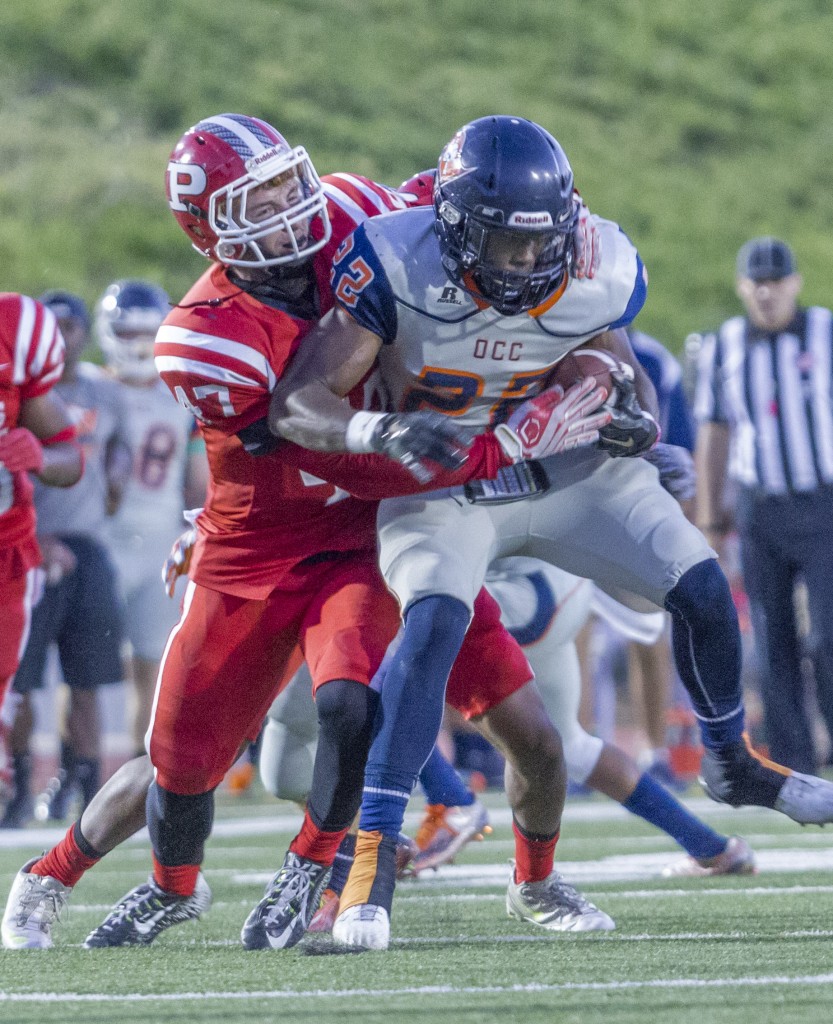 Number 47 Tanner Kanteman tries to bring down number 22 Kyle White during the Brahmas game against Orange Coast College on Oct. 10, 2015 at John Shephard Staidum at Pierce College, Woodland Hills, Calif. The Brahmas would lose 35-7 against the Pirates. Photo by: Gustavo Sanchez