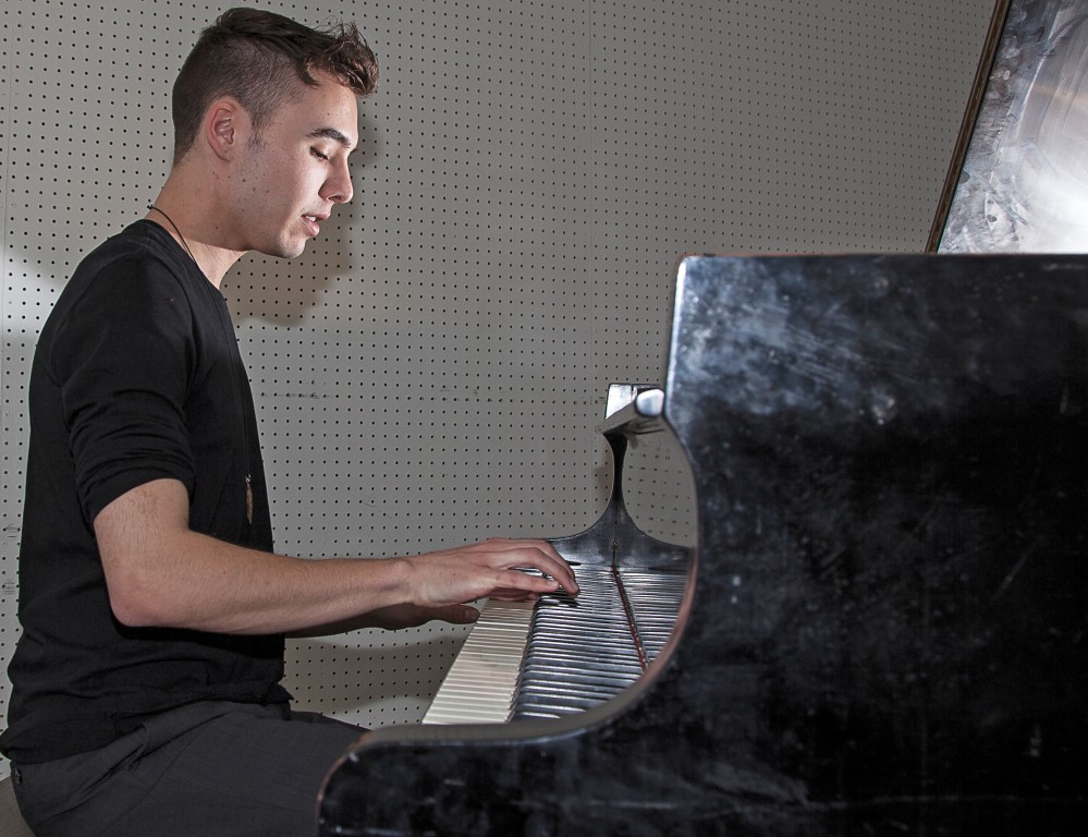 22-year-old Evan Henzi, a ethnomusicology major, plays his original score "Alien," on a piano inside one of the music rooms of the Music Center at Pierce College in Woodland Hills, Calif. on Wednesday, March 30, 2016. Photo: Mohammad Djauhari