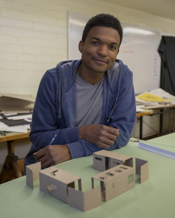 Rudy McCollum poses with his model container homes in the architecture studio on Thursday, April 28, 2016 at Pierce College in Woodland Hills,Calif. This model is designed for a single mother with a teenage child and a baby, inspired by Japanese homes. Photo: Travis Wesley