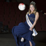 Jenny Godoy Lopez, winner of the 2015-2016 Reina Amigas Sensuntepecanas Los Angeles California, sits on the stage of the Performing Arts Building for a portrait on Sept. 15, 2016.  The soccer ball  is an example of what she handed out to children through her humanitarian work. At Pierce College in Woodland Hills, Calif. Photo by Taylor Arthur