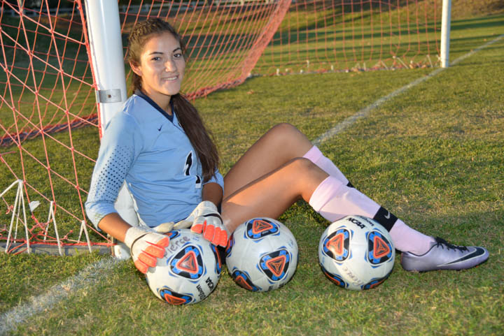 Goalie Brianna Jacobo poses with soccer balls at The Pit on Oct. 4, 2016 at Pierce College in Woodland Hills, Calif.