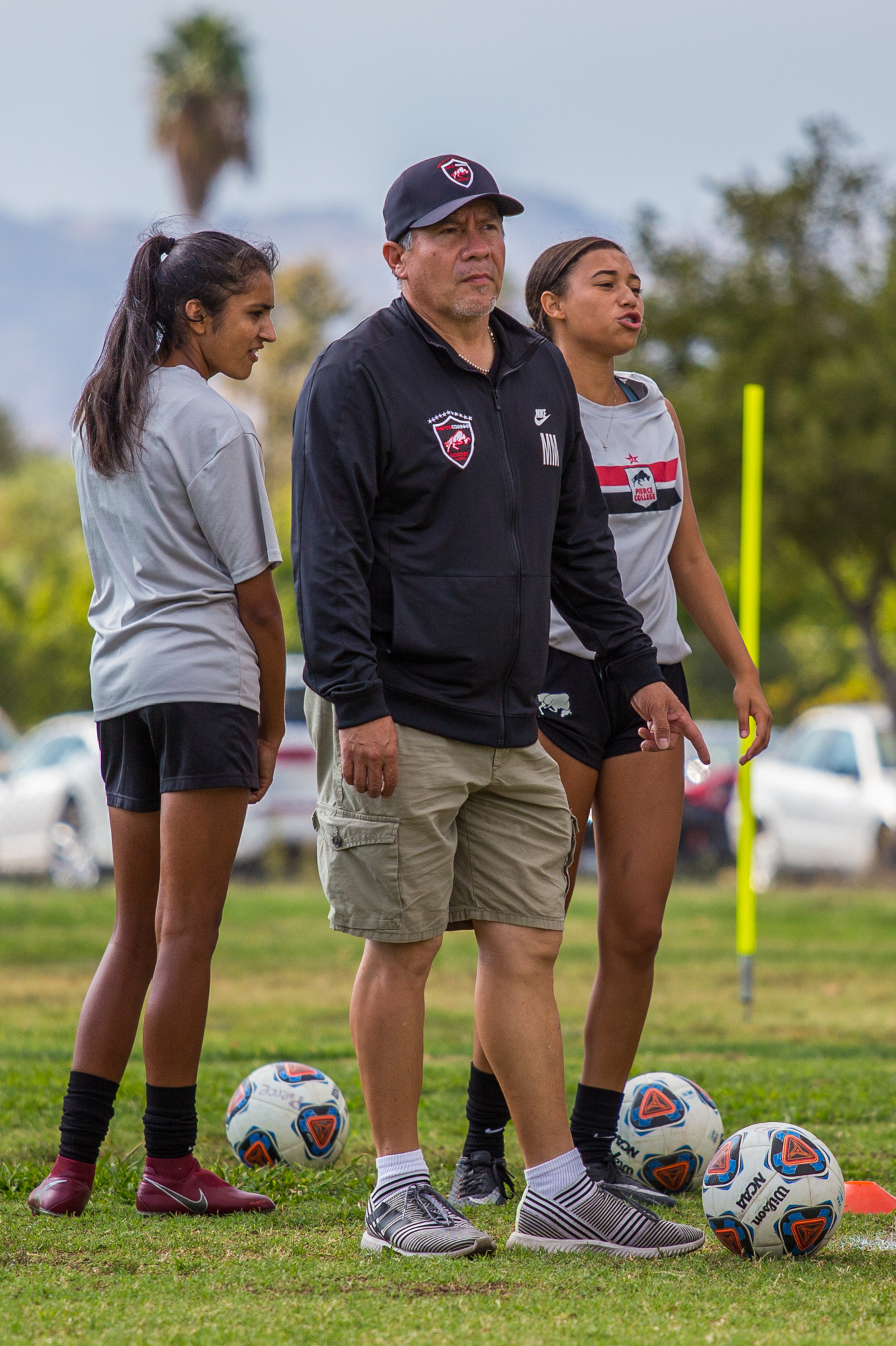 Assistant coach multitasks in many fields